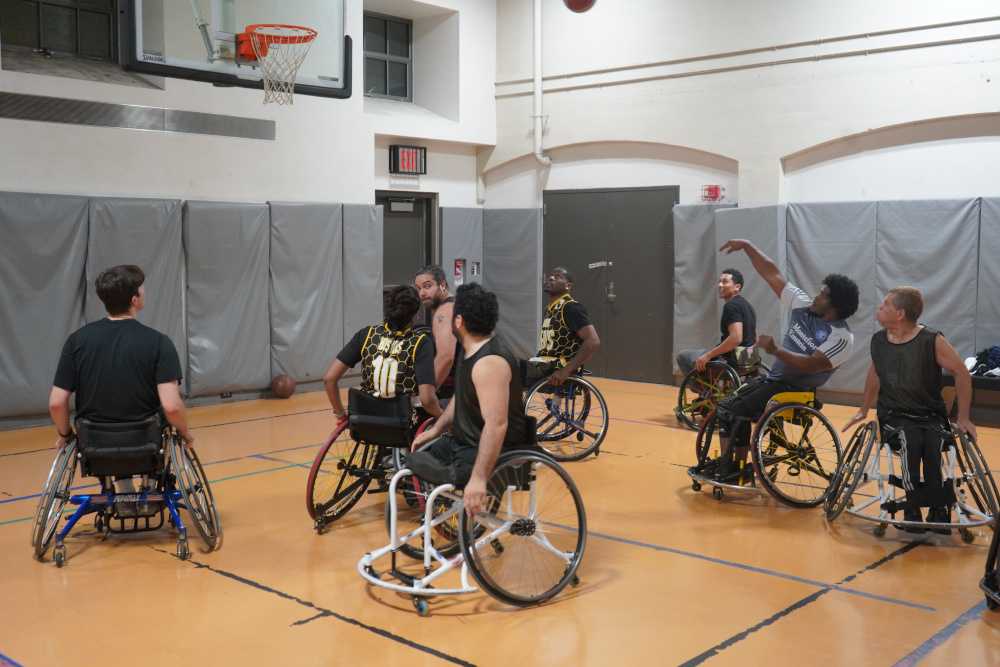Athletes playing wheelchair basketball 