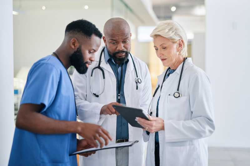 Three providers discussing charts