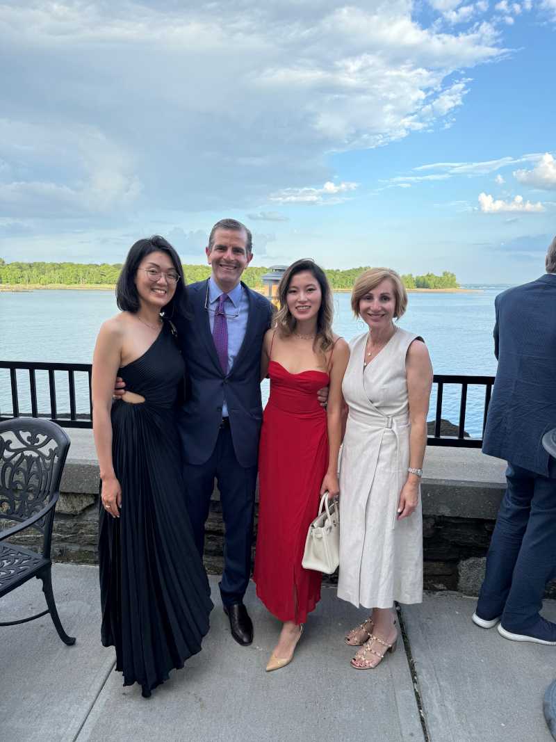 group of people outside dressed for dinner