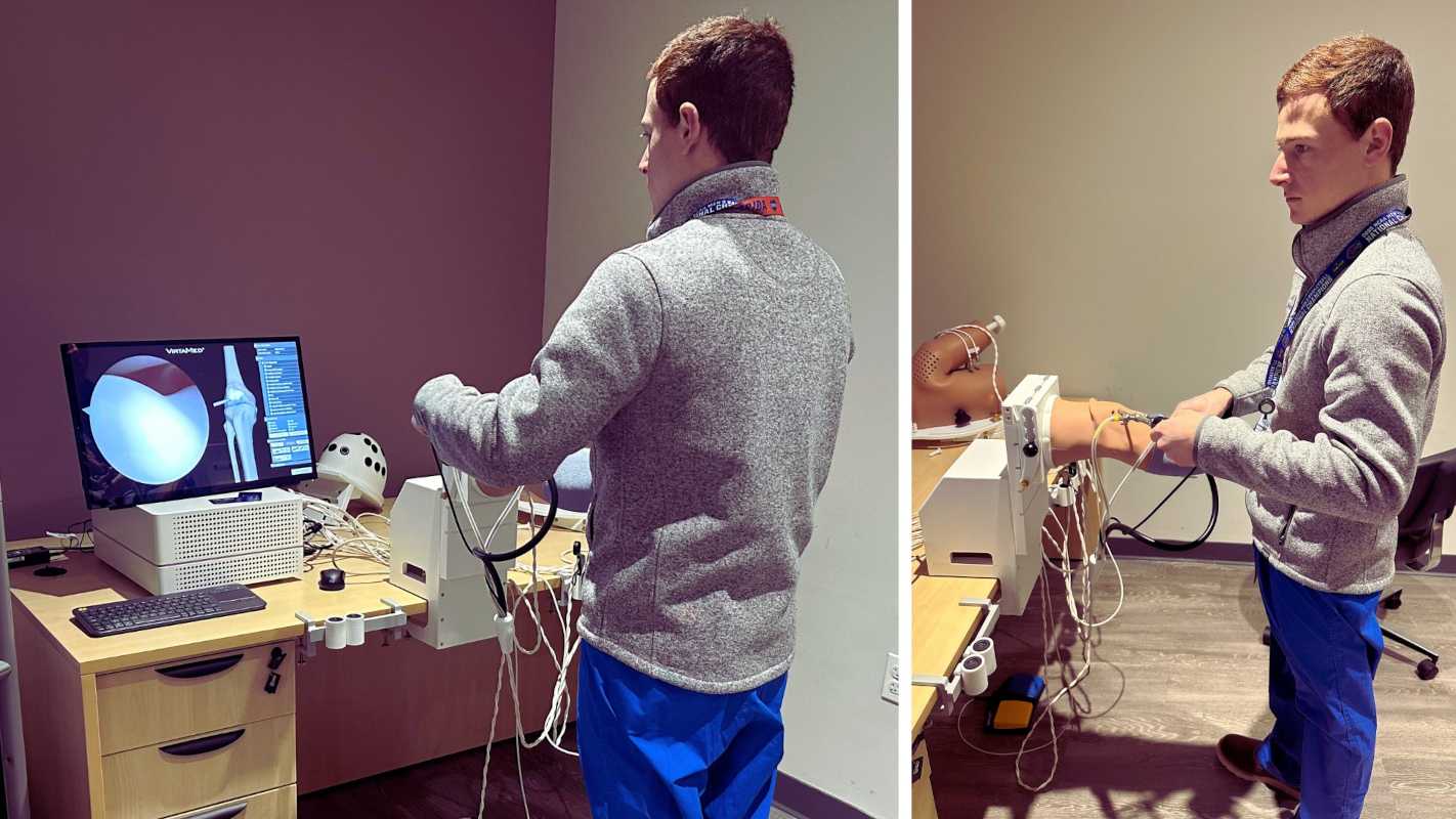 man in scrubs using imaging technology