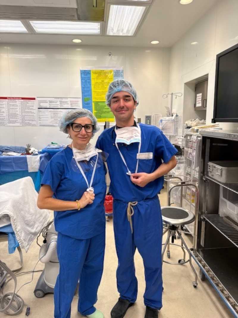 Two doctors in scubs in a hospital room