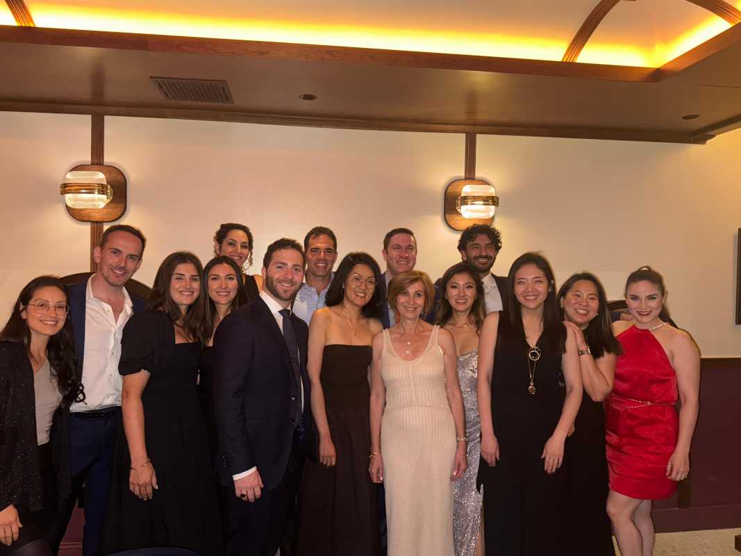 Large group of people posing for photo