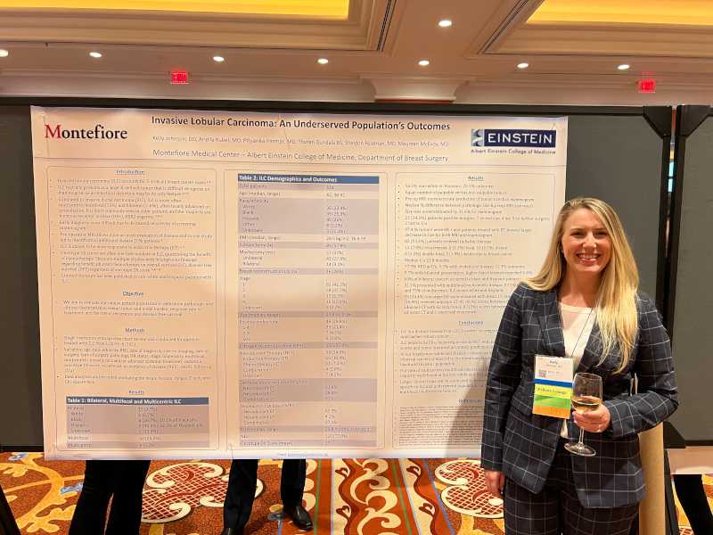 A presenter in front of a presentation